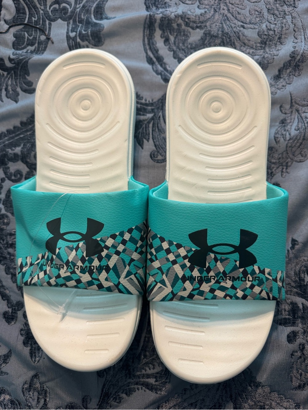 Under Armour Teal and White Woman’s Slide Sandals with Black Logos